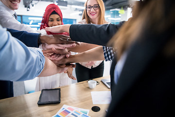 Image showing multiethnic Group of young business people celebrating success