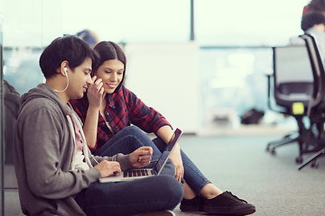 Image showing software developers couple working on the floor