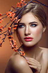 Image showing Beautiful girl with sakura branch