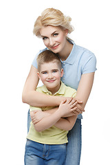 Image showing Young mother hugging son