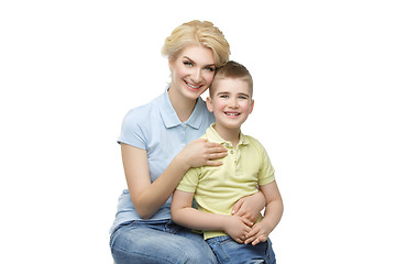 Image showing Young mother hugging son