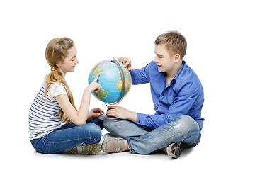 Image showing Teen boy and girl with earth globe