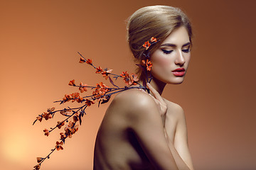 Image showing Beautiful girl with sakura branch