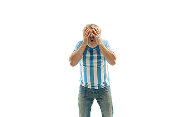 Image showing The unhappy and sad Argentinean fan on white background