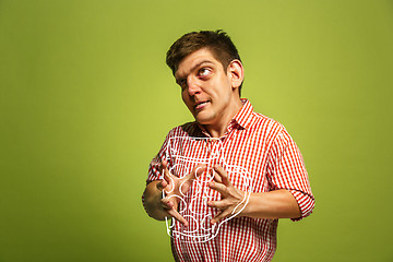 Image showing The funny man holding a mug of beer