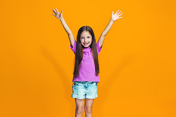 Image showing Happy success teen girl celebrating being a winner. Dynamic energetic image of female model