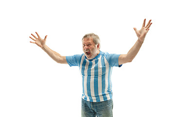 Image showing The Argentinean soccer fan celebrating on white background