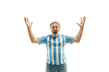 Image showing The Argentinean soccer fan celebrating on white background