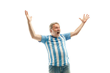 Image showing The Argentinean soccer fan celebrating on white background