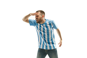 Image showing The unhappy and sad Argentinean fan on white background