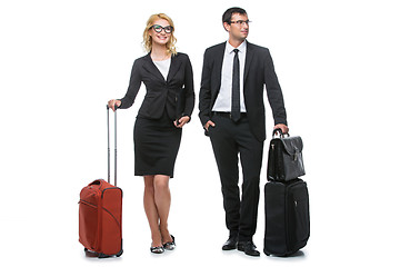 Image showing Businessman and business woman with travel cases