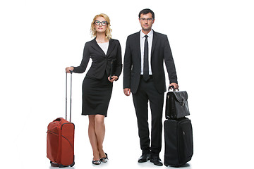 Image showing Businessman and business woman with travel cases