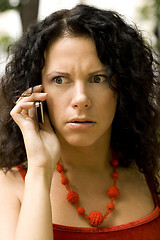 Image showing woman on phone getting bad news