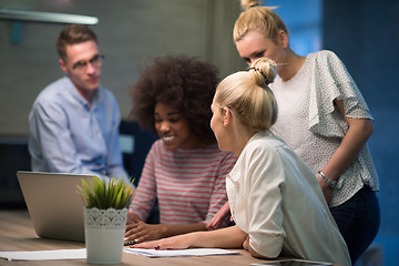 Image showing Multiethnic startup business team in night office