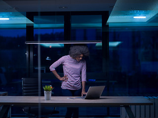 Image showing black businesswoman using a laptop in startup office