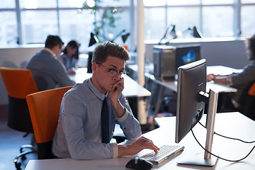 Image showing businessman working using a computer in startup office