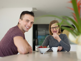 Image showing couple enjoying morning coffee and strawberries