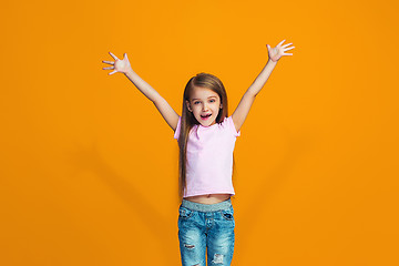 Image showing Happy success teen girl celebrating being a winner. Dynamic energetic image of female model