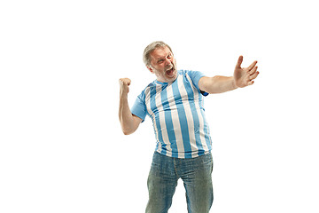 Image showing The Argentinean soccer fan celebrating on white background