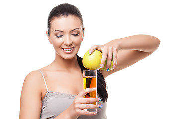 Image showing Beautiful girl with apple and glass of juice