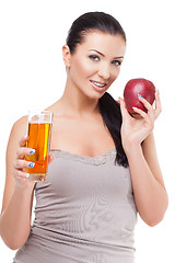 Image showing Beautiful girl with apple and glass of juice