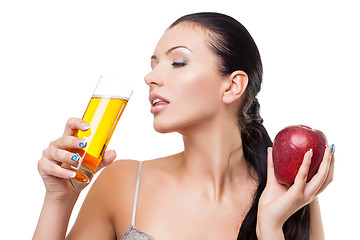 Image showing Beautiful girl with apple and glass of juice