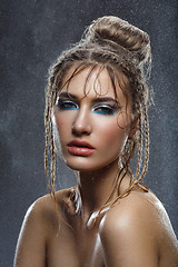 Image showing Beautiful girl with blue makeup in water drops