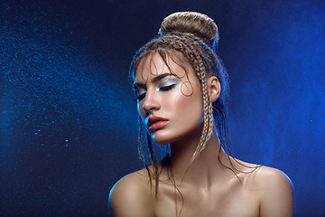 Image showing Beautiful girl with blue makeup in water drops