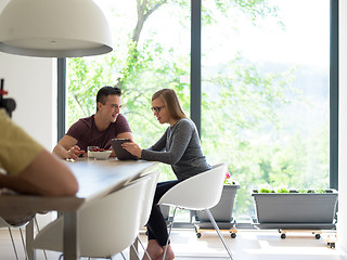 Image showing couple enjoying morning coffee and strawberries