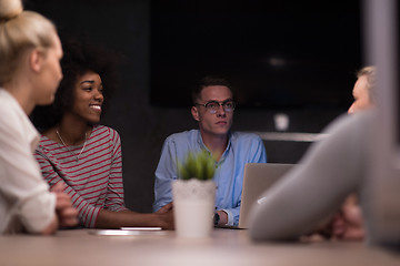 Image showing Multiethnic startup business team in night office