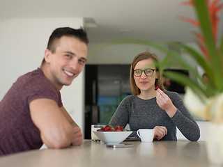 Image showing couple enjoying morning coffee and strawberries