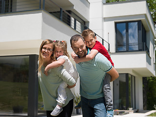 Image showing happy family with children in the yard