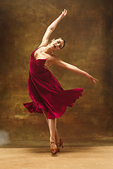 Image showing Young ballet dancer - Harmonious pretty woman with tutu posing in studio -