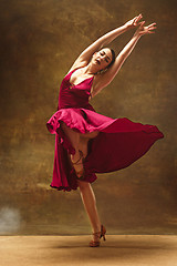 Image showing Young ballet dancer - Harmonious pretty woman with tutu posing in studio -