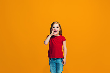 Image showing Isolated on pink young casual teen girl shouting at studio