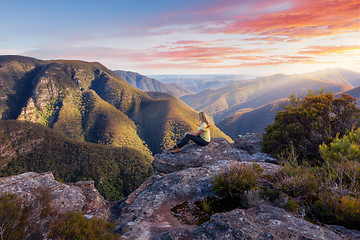 Image showing Female hiker admiring mountain wilderness beauty