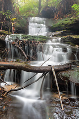 Image showing Water cascading down the mountain valley