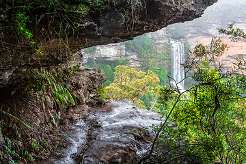 Image showing Natures window to a waterfall viewed through the cliff ledge