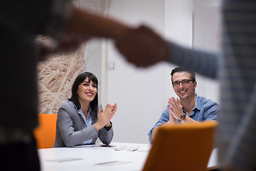 Image showing cloasing the deal in modern office interior