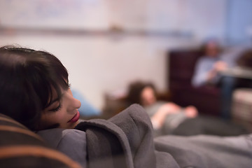 Image showing software developers sleeping on sofa in creative startup office