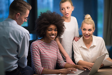 Image showing Multiethnic startup business team in night office