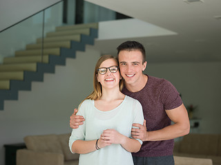 Image showing couple hugging in their new home