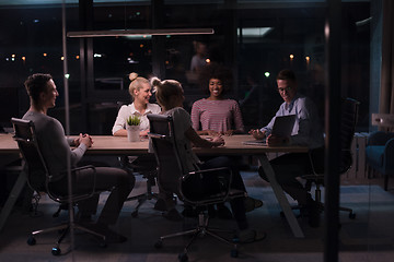 Image showing Multiethnic startup business team in night office