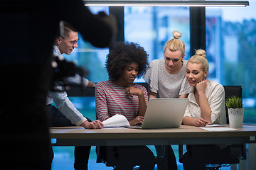 Image showing Multiethnic startup business team in night office