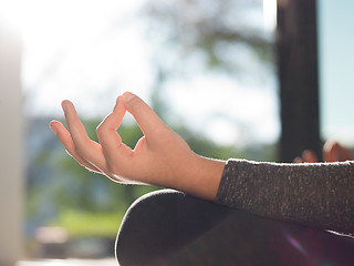 Image showing young woman doing morning yoga exercises