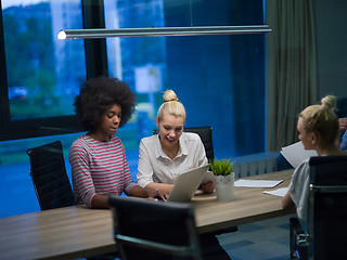 Image showing Multiethnic startup business team in night office