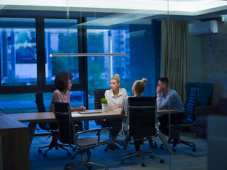 Image showing Multiethnic startup business team in night office