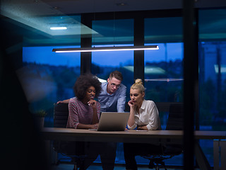 Image showing Multiethnic startup business team in night office