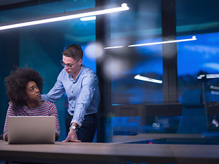 Image showing Multiethnic startup business team in night office