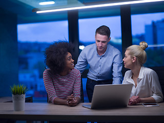 Image showing Multiethnic startup business team in night office